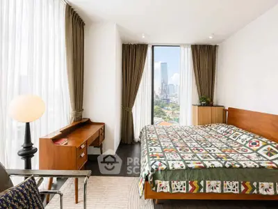 Modern bedroom with city view, featuring stylish furniture and floor-to-ceiling windows.