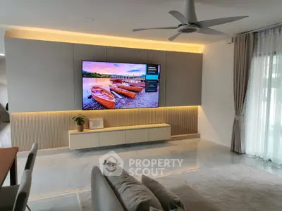 Modern living room with large TV and stylish decor