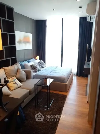 Modern studio apartment with cozy living area and stylish decor