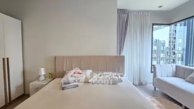 Modern bedroom with elegant decor and large window view