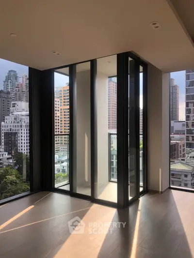 Stunning corner unit with floor-to-ceiling windows offering breathtaking city views in a modern high-rise.