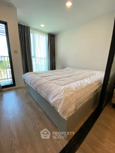 Modern bedroom with large windows and stylish decor