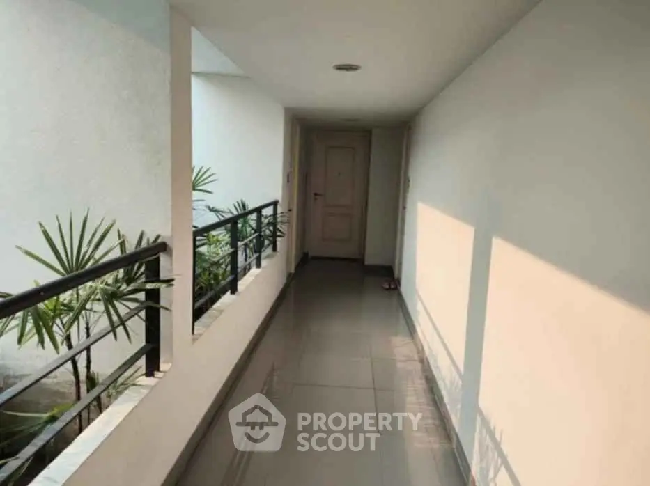 Bright corridor with modern design and natural light in residential building