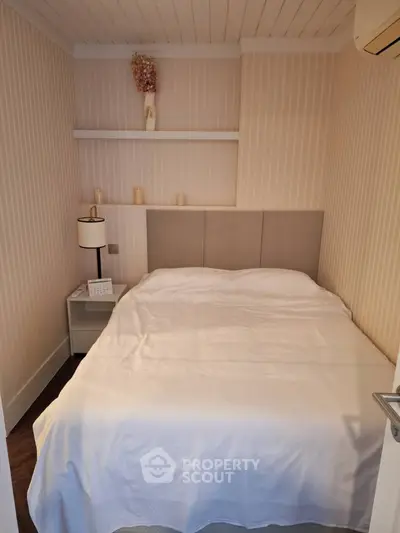 Cozy bedroom with elegant decor and soft lighting, perfect for relaxation.