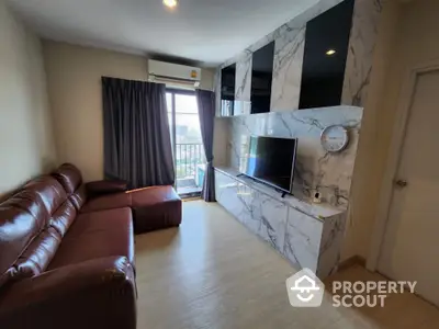 Modern living room with marble TV wall and leather sofa, featuring a city view from the window.