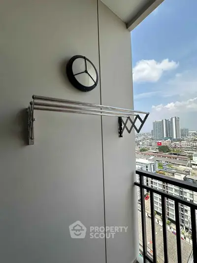 Modern balcony with city view and retractable clothes rack