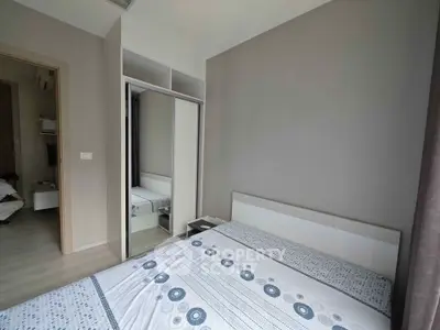 Modern bedroom with mirrored closet and stylish decor