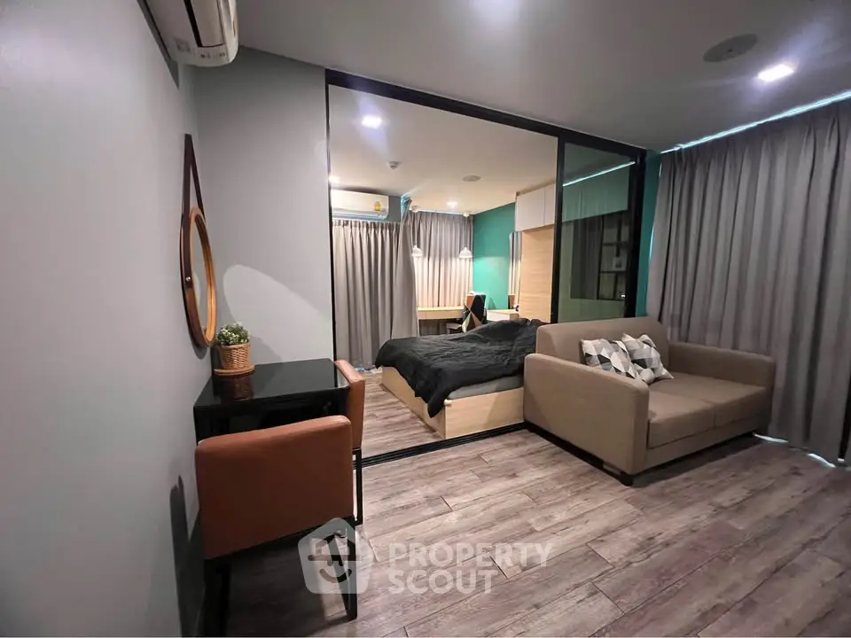 Modern studio apartment with cozy living area and stylish bedroom