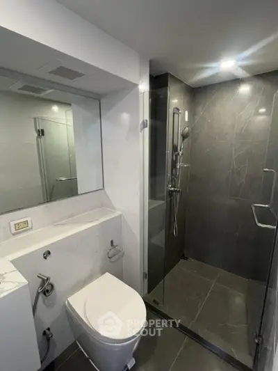 Modern bathroom with sleek shower and elegant marble finishes