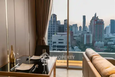 Luxurious living room with stunning city view, elegant dining setup, and modern furnishings.