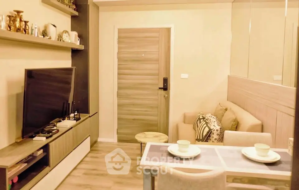 Cozy living room with modern decor and dining area, perfect for urban living.