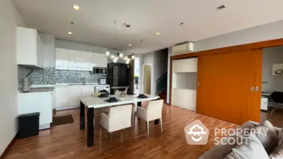 Spacious modern kitchen with open layout and stylish dining area