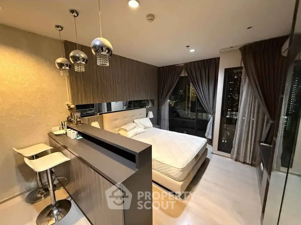 Luxurious modern bedroom with city view, elegant lighting, and stylish decor in high-rise apartment.
