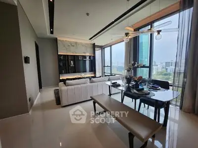 Luxurious modern living room with panoramic city view and elegant dining area.
