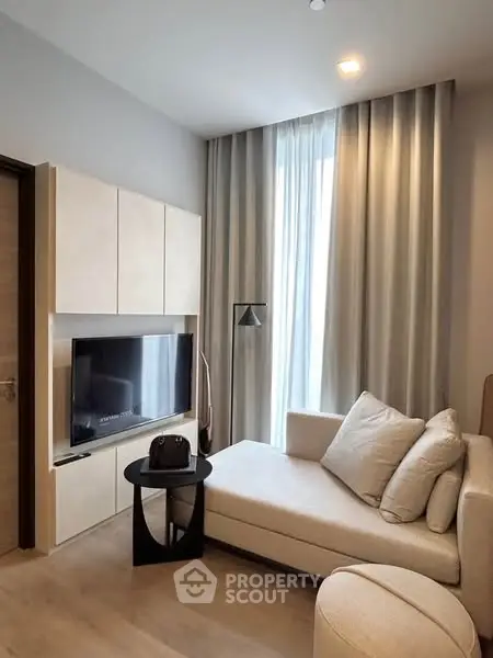 Modern living room with cozy sofa and sleek TV setup
