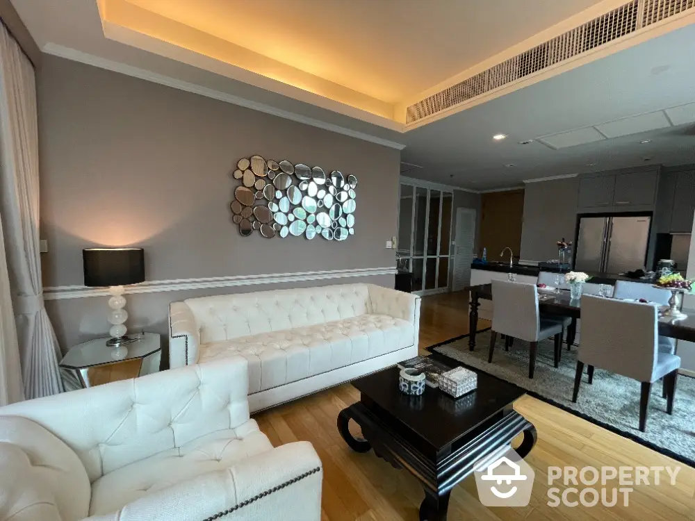 Luxurious living room with elegant decor and modern kitchen in open layout apartment