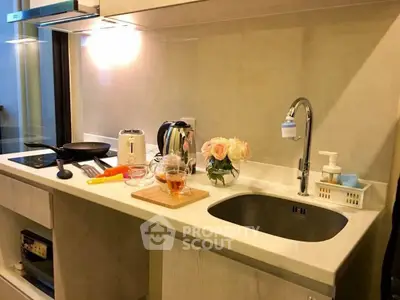 Modern kitchen with sleek countertop and appliances, perfect for culinary enthusiasts.