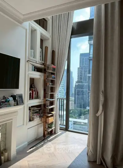 Luxurious living room with floor-to-ceiling windows offering stunning city views, elegant shelving, and chic decor.
