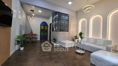 Spacious modern living room with elegant lighting and stylish decor