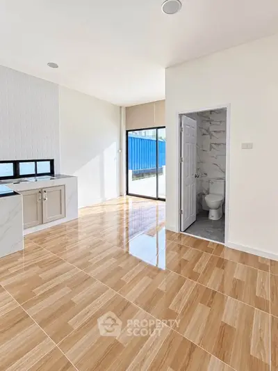 Spacious modern interior with glossy wooden flooring and natural light