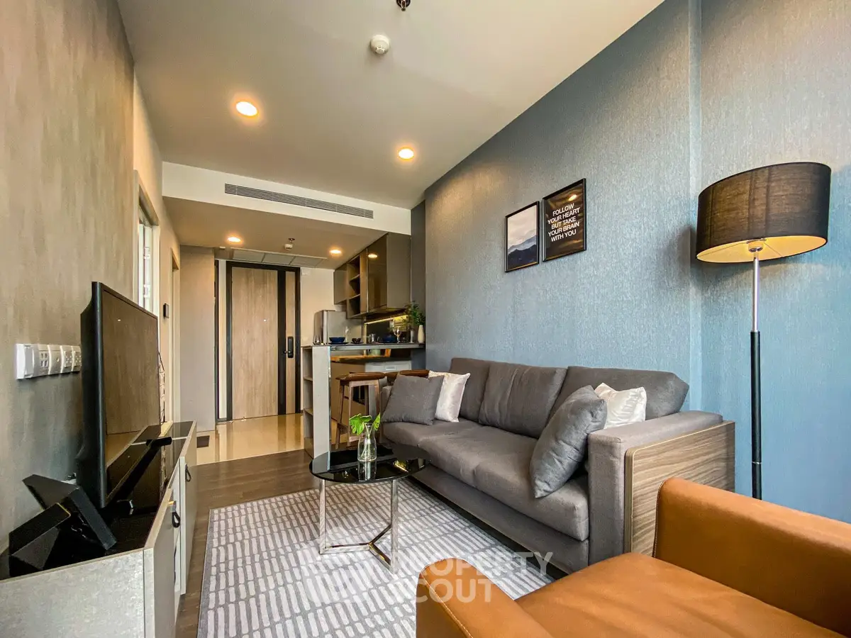 Modern living room with stylish decor and open kitchen layout