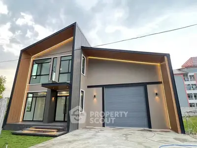 Modern architectural house with sleek design and large garage door