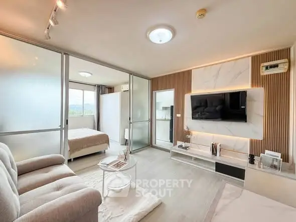 Modern open-plan living room with stylish decor and natural light