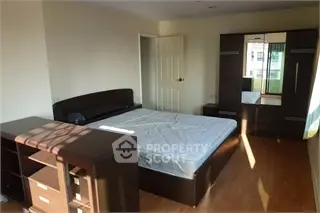 Spacious bedroom with modern furniture and natural light