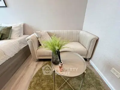 Cozy bedroom corner with stylish sofa and modern decor