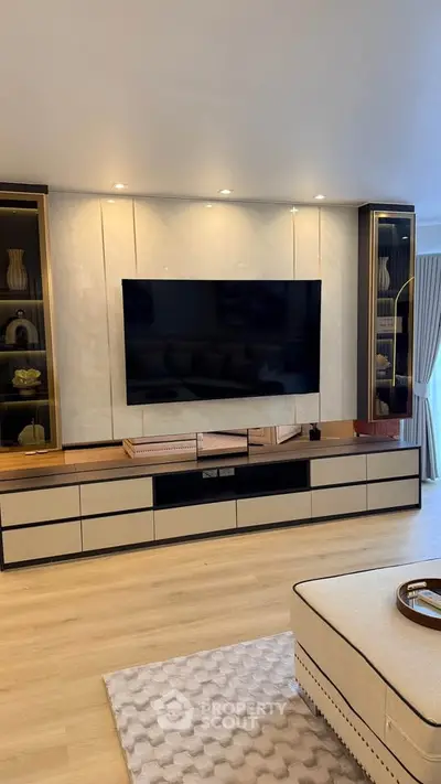 Luxurious living room with modern TV setup and elegant decor