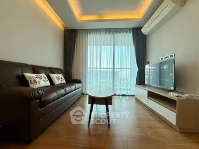 Modern living room with leather sofa, stylish lighting, and large window with city view.