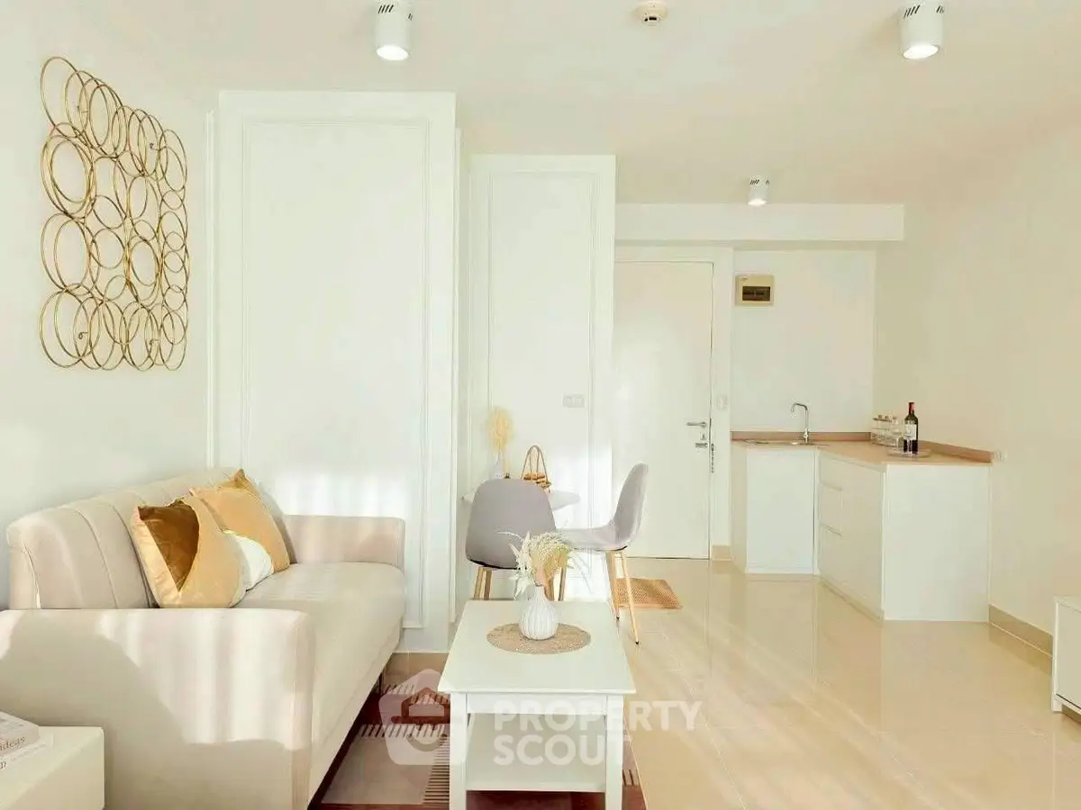 Bright and modern living room with stylish decor and cozy seating area.