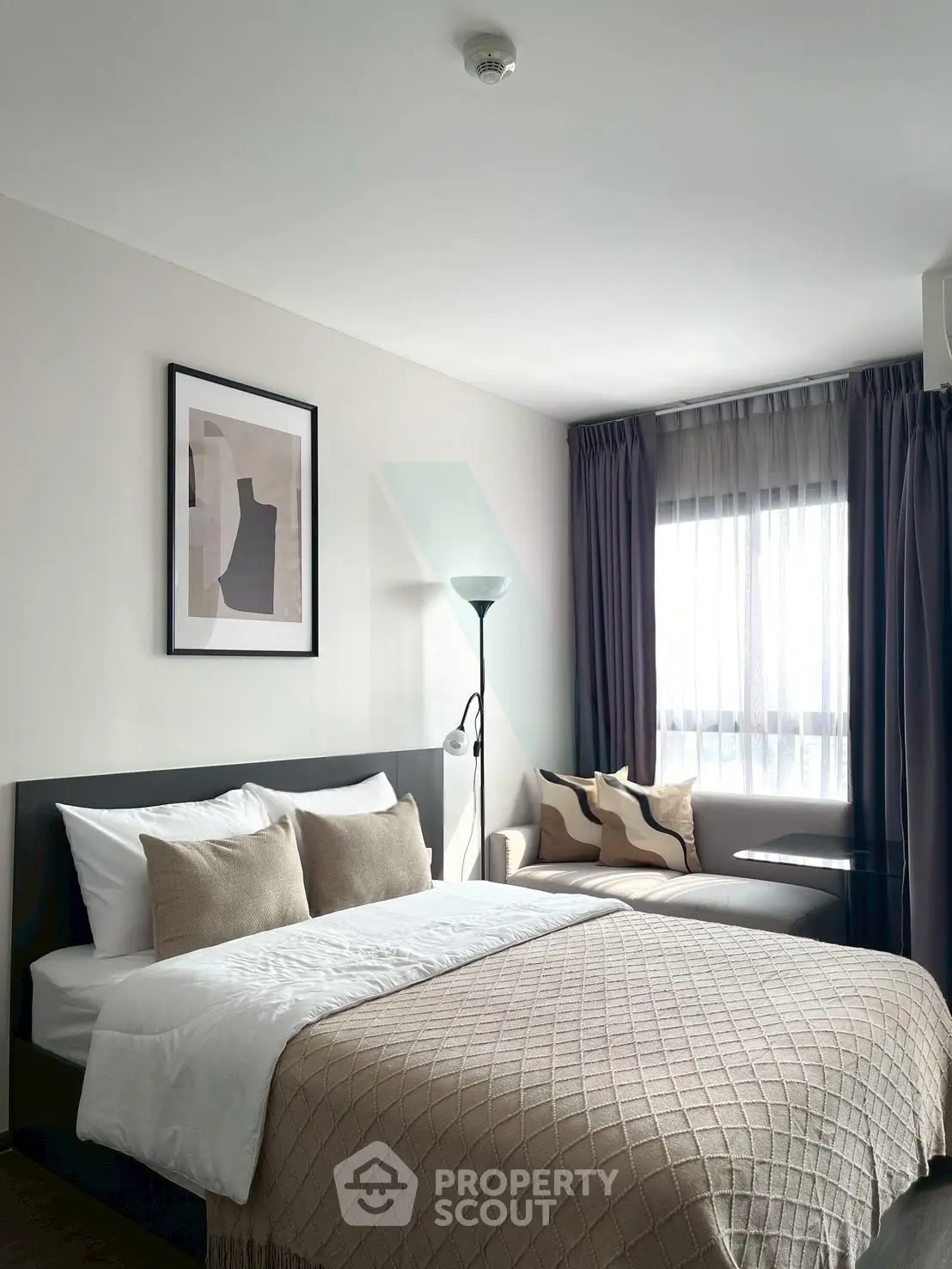 Modern bedroom with cozy decor and natural light