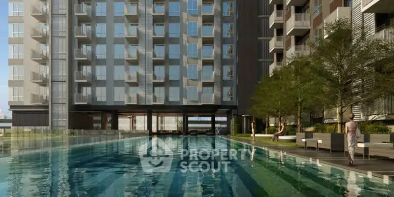 Modern apartment building with luxurious pool and outdoor seating area.