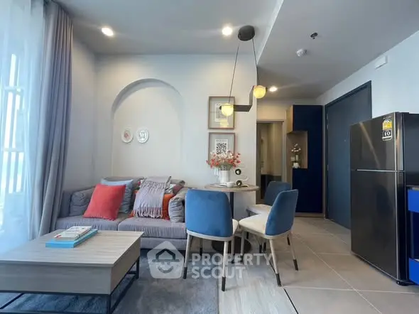 Modern living room with stylish decor and cozy seating area in a contemporary apartment.
