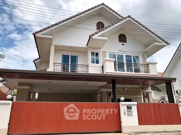 Charming two-story house with spacious balcony and modern design in a serene neighborhood.