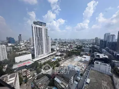 Stunning cityscape view showcasing modern high-rise buildings and urban skyline under a clear blue sky.