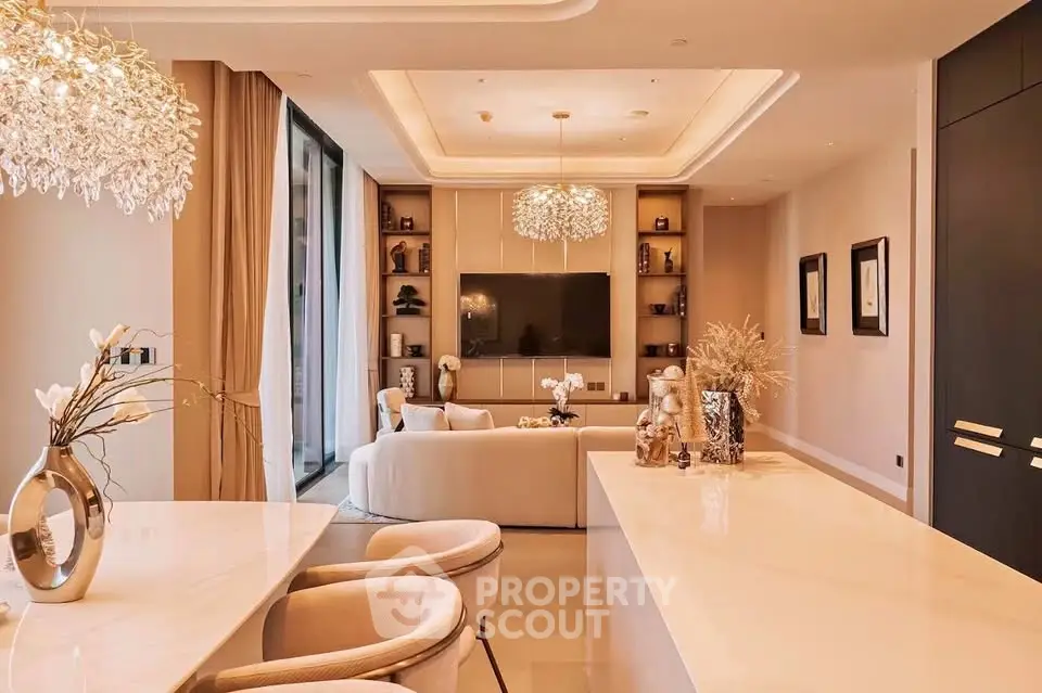 Luxurious modern living room with elegant decor and open layout, featuring stylish lighting and a spacious design.