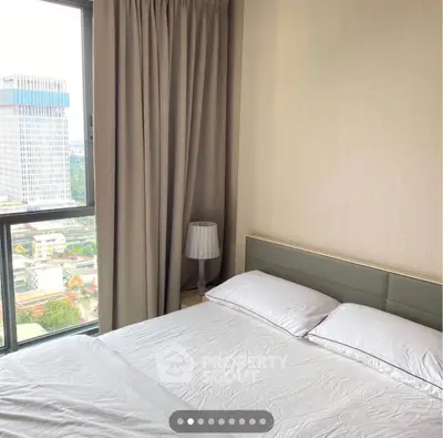 Modern bedroom with city view and elegant decor