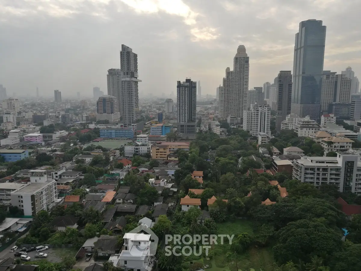 Stunning cityscape view showcasing high-rise buildings and lush greenery, perfect for urban living.