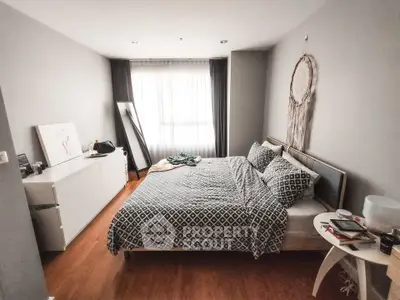 Cozy bedroom with stylish decor and natural light