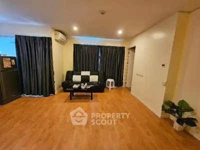 Spacious living room with wooden flooring and modern decor
