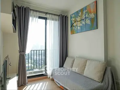 Modern living room with balcony view and stylish decor in urban apartment