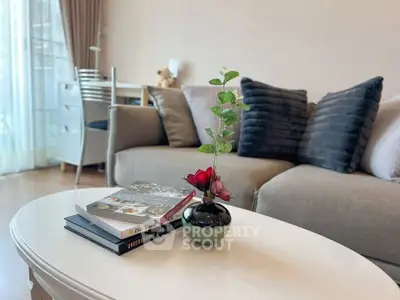 Stylish living room with cozy sofa and elegant decor, perfect for relaxation and entertaining.