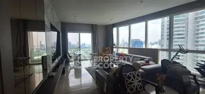 Luxurious high-rise living room with panoramic city views and modern furnishings.
