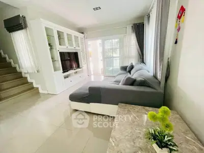 Spacious living room with modern decor and natural light