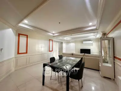 Spacious living room with elegant decor and modern furniture in a luxury apartment.