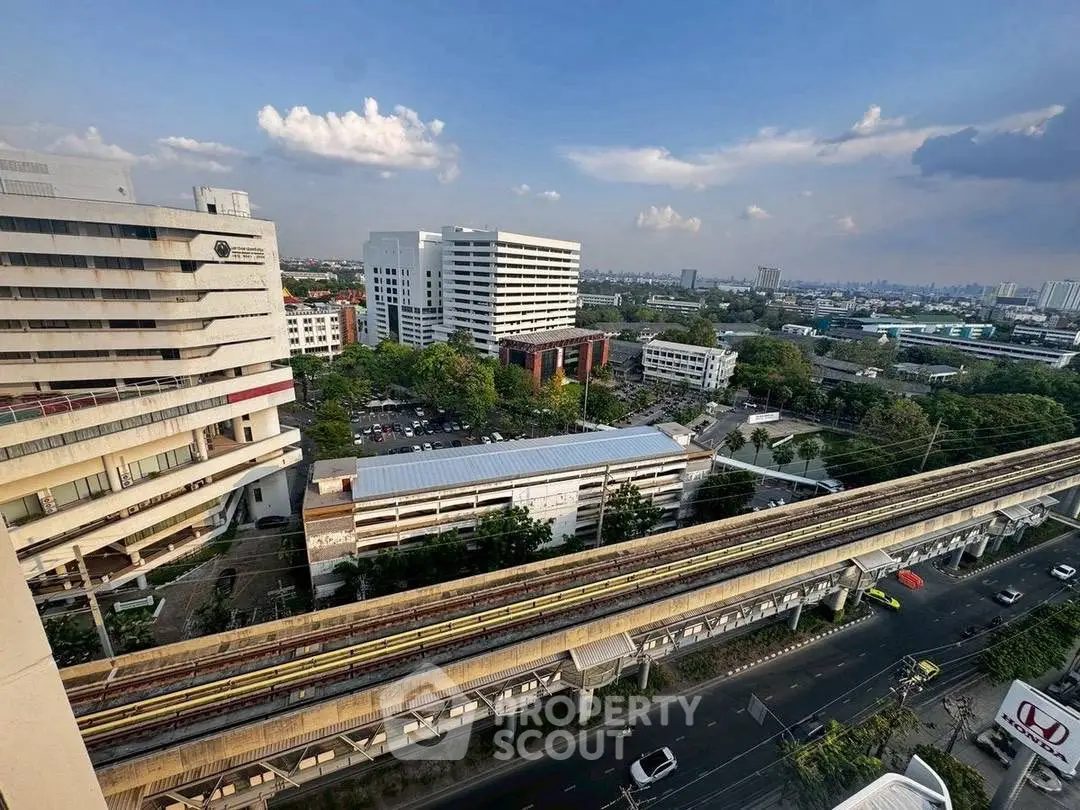 Stunning cityscape view from high-rise building showcasing urban infrastructure and skyline.