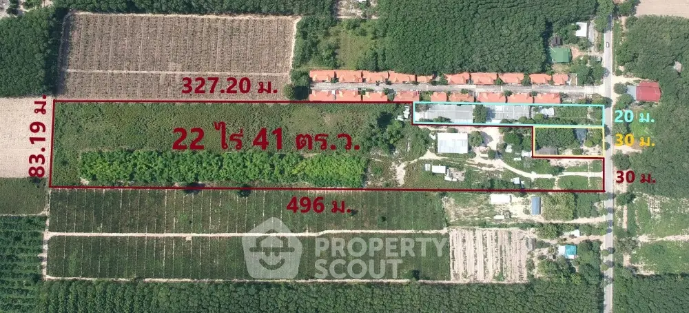 Aerial view of expansive land plot with dimensions and area marked, surrounded by lush greenery and residential buildings.