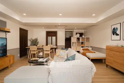 Spacious living room with modern decor and cozy seating area